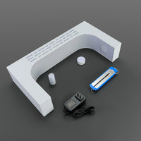 White levitating saber stand laid out with power adapter and display accessories